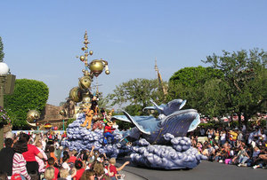 Daytime and nighttime parades that celebrate Disney films or seasonal holidays with characters, music, and large floats