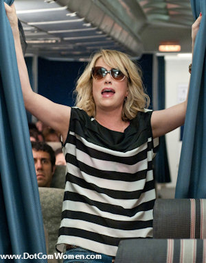 Kristen Wiig's black and white striped top in the Flight scene from Bridesmaids
