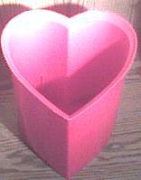 red heart-shaped trash can