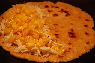 Spreading filling over just half of the tortilla surface