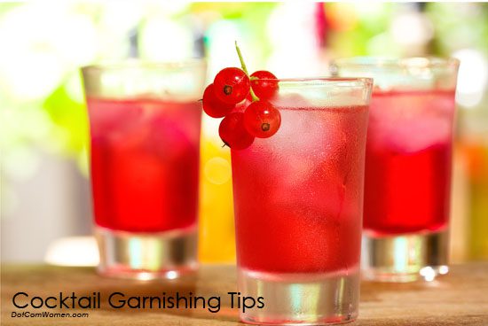 red cocktail garnished with berries