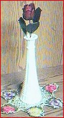 single red metal rose in a vase