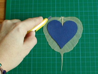 cutting large heart from skeleton leaf
