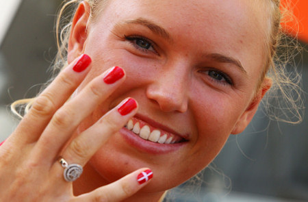 Caroline Wozniacki of Denmark shows her Nail Art at the London Olympics