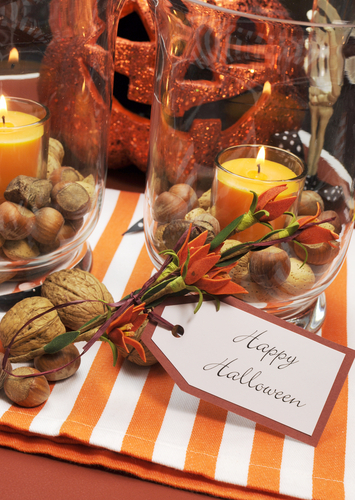 halloween pumpkin and candles table centerpiece