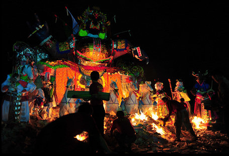 Burning Decorations as an Offering to Ghosts - Chinese Hungry Ghost Festival