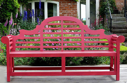 Red painted garden bench