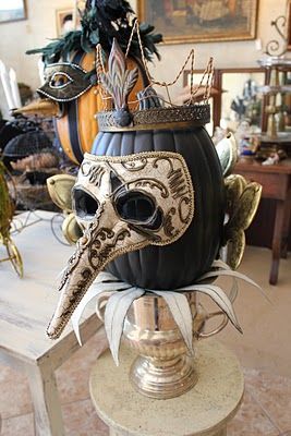 Black painted pumpkin with Mask - Decorating for a Halloween masquerade party