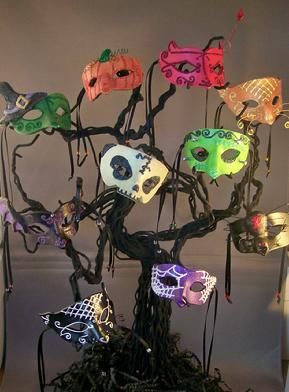 Halloween masks tree decoration idea for a Masquerade Party